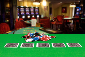 poker-chips-on-a-gaming-table-in-a-casino - gambling - real action slots