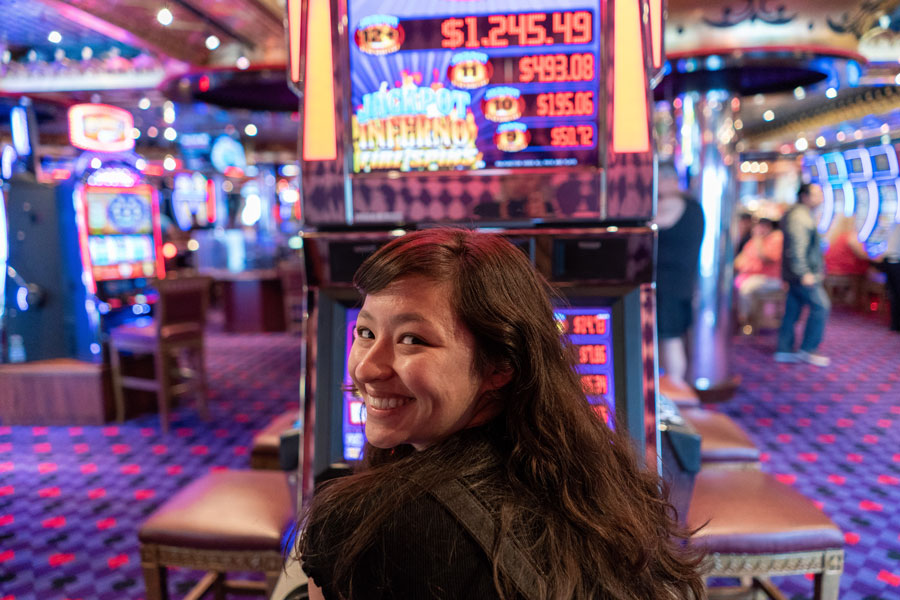 woman gambling at slots - slot machines - real action slots