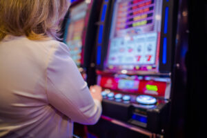 woman play slots - online gambling - us gambling sites - real action slots