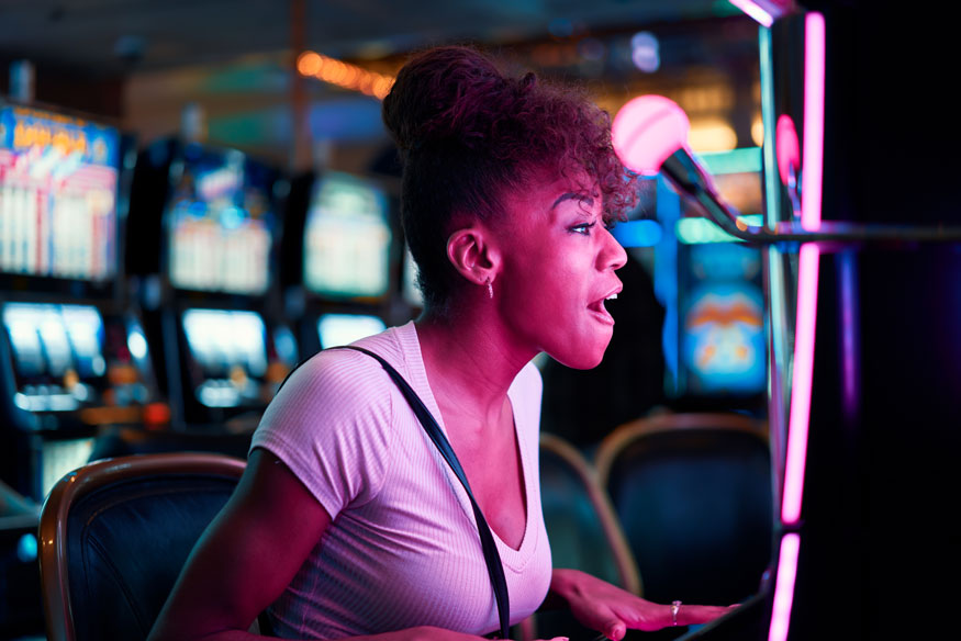 slot machine sound effects - woman having fun at a slot machine - real action slots